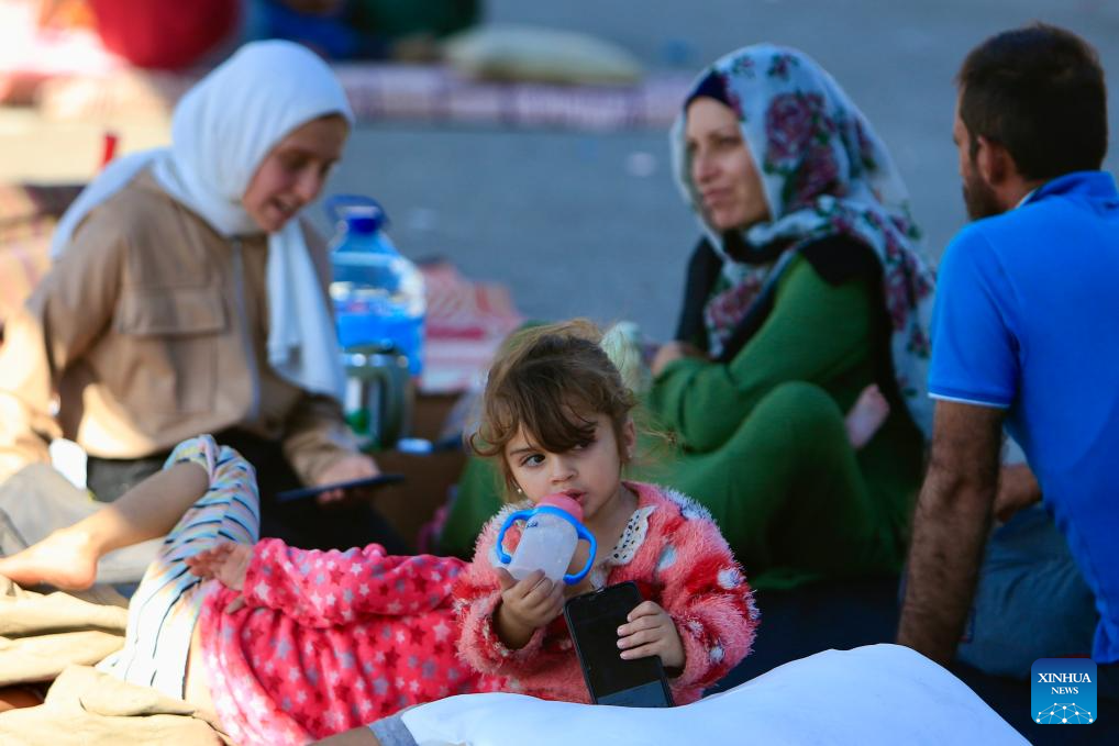 Displaced people live at parking lot in Sidon, Lebanon